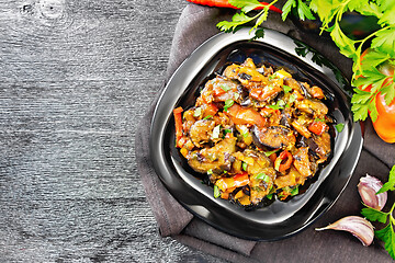 Image showing Ragout with eggplant and pepper on black board top