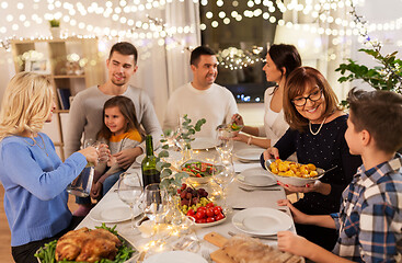 Image showing happy family having dinner party at home