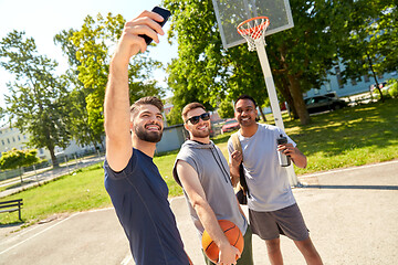 Image showing happy men taking selfie on basketball playground