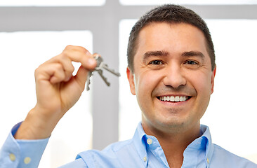 Image showing happy smiling man holding keys
