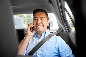 Image showing male passenger calling on smartphone in taxi car