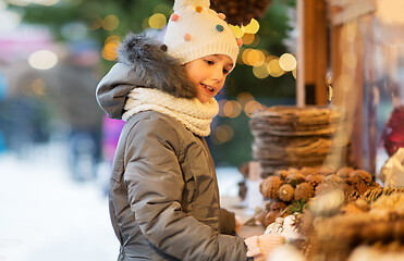 Image showing happy little girl at christmas market in winter