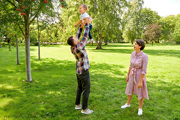 Image showing happy family having fun at summer park