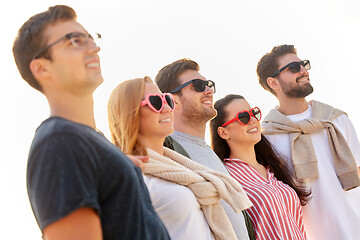 Image showing happy friends on summer beach