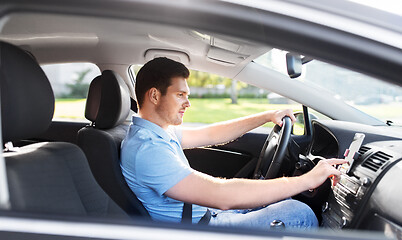 Image showing man or driver driving car and using gps navigator