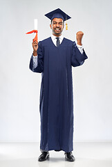 Image showing happy graduate student in mortarboard with diploma