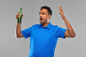 Image showing emotional indian man or sports fan beer bottle