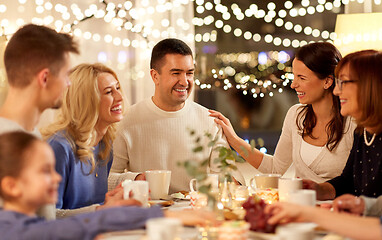 Image showing happy family having tea party at home