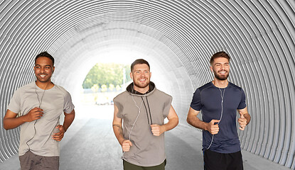 Image showing male friends with earphones running outdoors