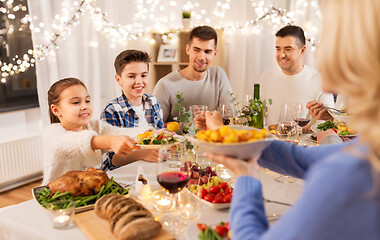 Image showing happy family having dinner party at home