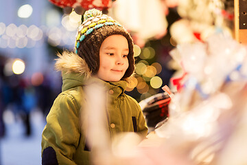 Image showing happy little boy at christmas market in winter