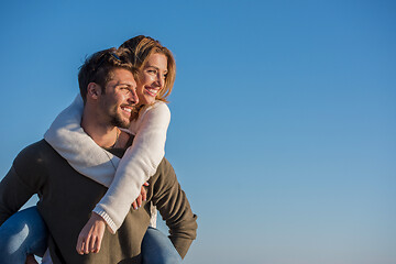 Image showing couple having fun at beach during autumn