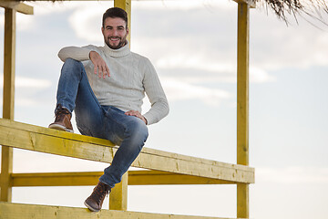 Image showing Young man enjoying the warm autumn day