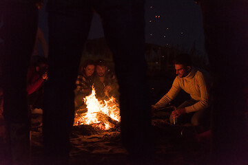 Image showing Friends having fun at beach on autumn day