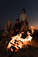 Image showing Friends having fun at beach on autumn day