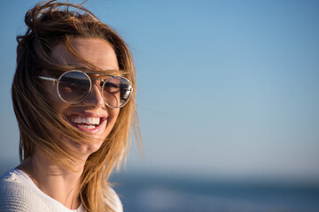 Image showing Young woman enjoying the warm autumn day