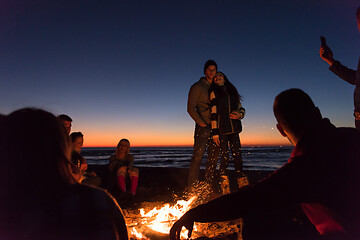 Image showing Friends having fun at beach on autumn day