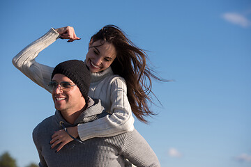 Image showing couple having fun at beach during autumn