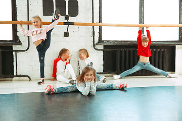 Image showing The kids at dance school. Ballet, hiphop, street, funky and modern dancers