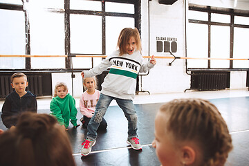 Image showing The kids at dance school. Ballet, hiphop, street, funky and modern dancers