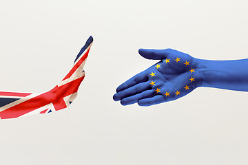 Image showing Male hands colored in United Kingdom and European Unity flags