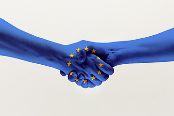 Image showing Male hands holding colored in EU flag