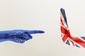 Image showing Male hands colored in United Kingdom and European Unity flags