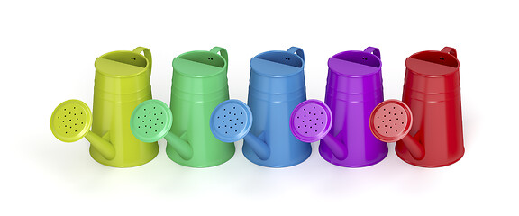 Image showing Row with colorful watering cans