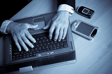 Image showing Senior businessman and laptop