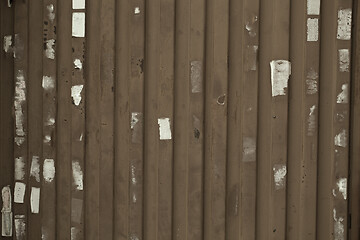 Image showing Wooden wall or fence with poster remnants