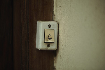 Image showing Close up on a filthy old electric doorbell fitting