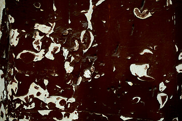 Image showing Old wooden panel with grungy peeling dark paint