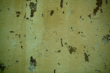 Image showing Grunge off white stained wall with flaky paint