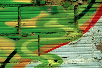 Image showing Striated pattern bricks with colorful graffiti