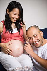 Image showing Happy expecting asian parents