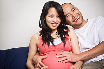Image showing Happy expecting pregnant asian couple