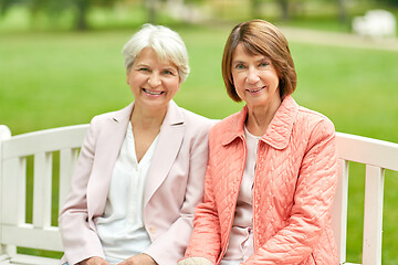 Image showing senior women or friends sitting on bench at park