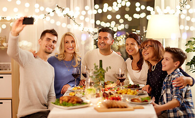 Image showing family having dinner party and taking selfie