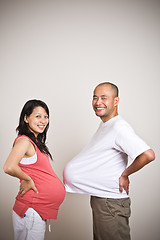 Image showing Happy expecting pregnant asian couple