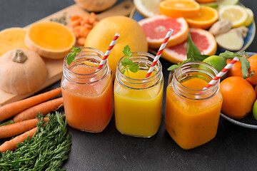 Image showing mason jar glasses of vegetable juices on table