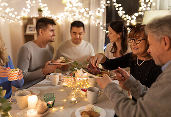 Image showing happy family having tea party at home