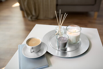 Image showing coffee, candles and aroma reed diffuser on table