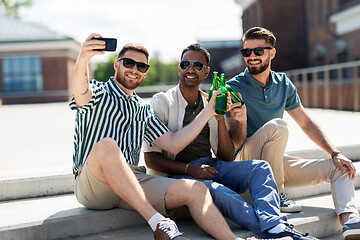 Image showing men toasting beer and taking selfie by smartphone