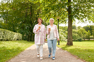 Image showing senior women or friends drinking coffee at park