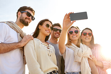 Image showing happy friends taking selfie in summer