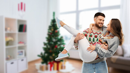 Image showing happy couple at christmas ugly sweater party