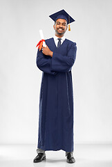 Image showing male graduate student in mortar board with diploma