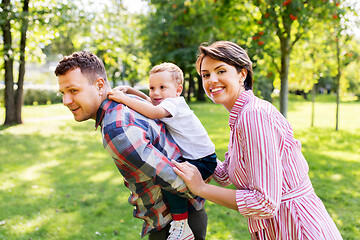 Image showing happy family having fun at summer park