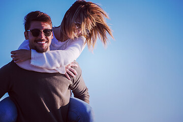 Image showing couple having fun at beach during autumn