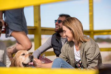 Image showing Group of friends having fun on autumn day at beach